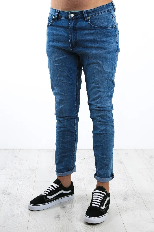 Men's Straight Leg Raw Denim Jeans for a Minimalist and Durable OptionThe Tapered Slim Jean Stoweaway Wash