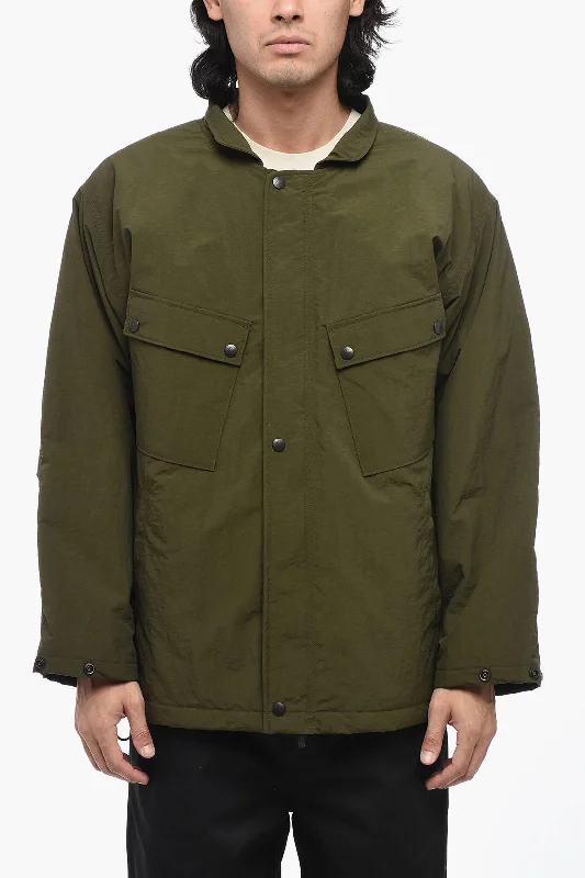 Long - line men coats reaching below the knee for maximum coverageNeedles Solid Color Nylon Utility Jacket